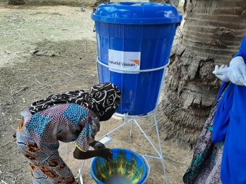 child washing her hands