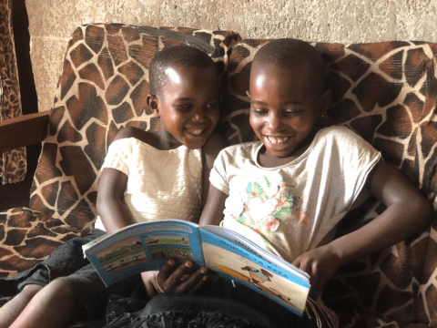 Kellen(right side) and her little sister cheerfully reading