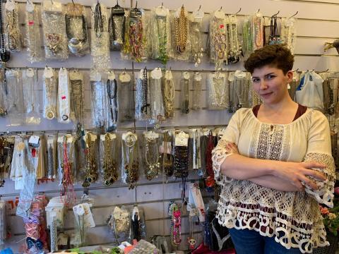 Rita in her store by her handmade accessories