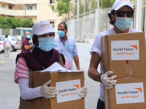 World Vision staff in Lebanon carry boxes of emergency supplies to those affected the the tragic explossion in Beirut
