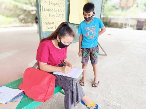Mae a young woman from Philippines teaches vulnerable children to read during COVID-19 lockdowns