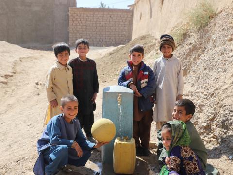 Children are happy for the water tap