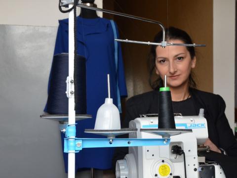 Ana at her small sewing area