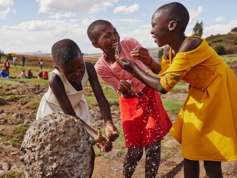 Girls enjoy access to clean water in Lesotho