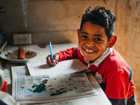 The gift of a warm blanket helps keep Victor warm in his Honduras village