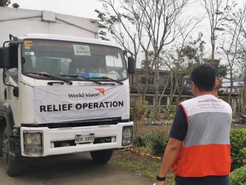 World Vision staff in convoy to provide aid to people affected by Typhoones in the Philippines