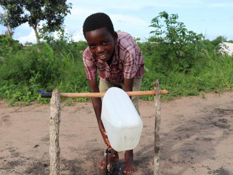 Augusto is showing a proper handwashing style thought by World Vision 