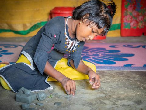 girl draws on the ground