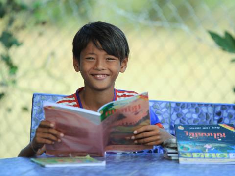 Sponsored child Chamrong loves learning at the reading club.