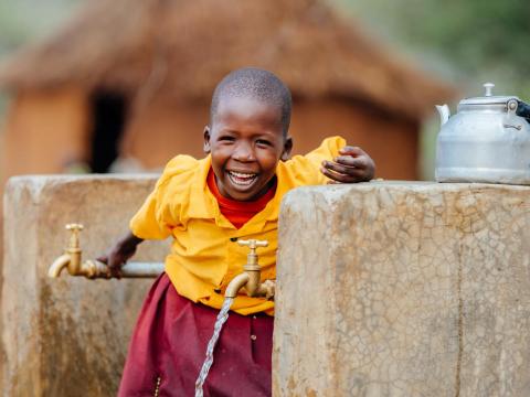 Cheru at water tap with clean water