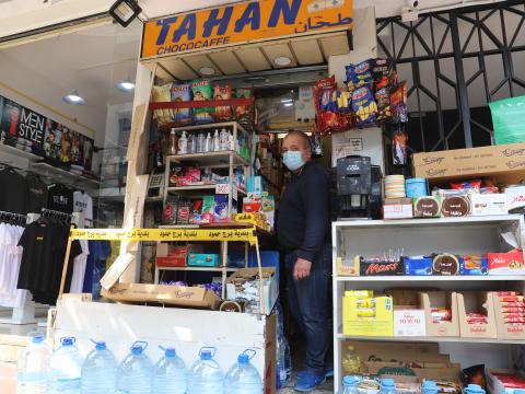 Khalil Tahan standing in front of his small shop