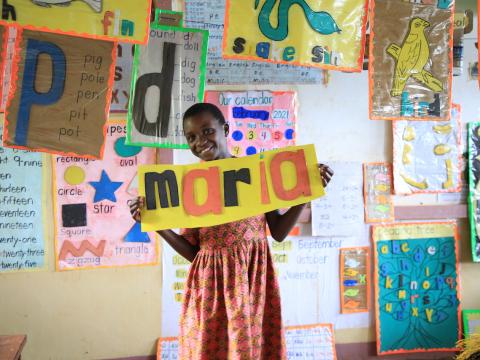 Maria in her print-rich classroom. World Vision supports the initiative of improving the classroom environment to boost learners' experience.