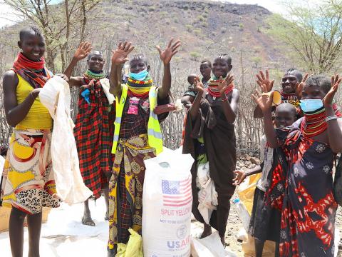 Hearts filled with joy.Beneficiaries express their gratitude after receiving food from World Vision in response to the hunger crisis in Turkana County kenya.©World Vision photo/Martin Muluka.