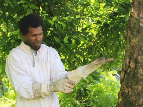 David Suda checking his farm