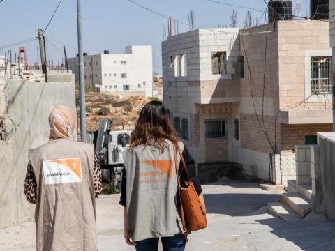 World Vision staff look on West Bank