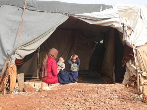Syrian mother and children in tent