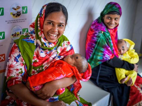 Hena holds her son Ibrahim at the Chunkuri Community Clinic.