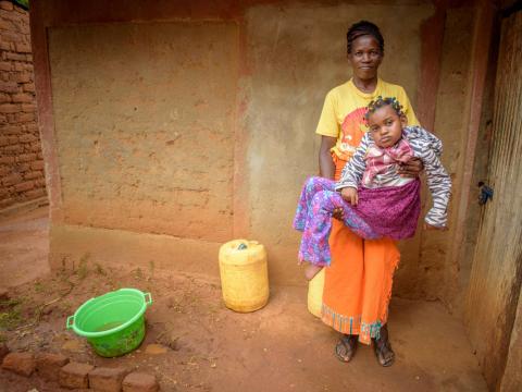 Janet used to have to carry her daughter Cynthia everywhere, until child sponsorship helped her get access to a wheelchair