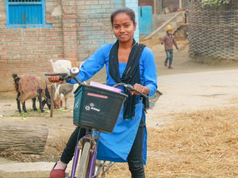 Sunita can now attend school every day on time thanks to her bicycle.