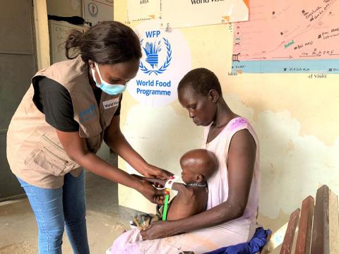 Child having upper arm circumfrance measured to determin state of malnutrition in South Sudan