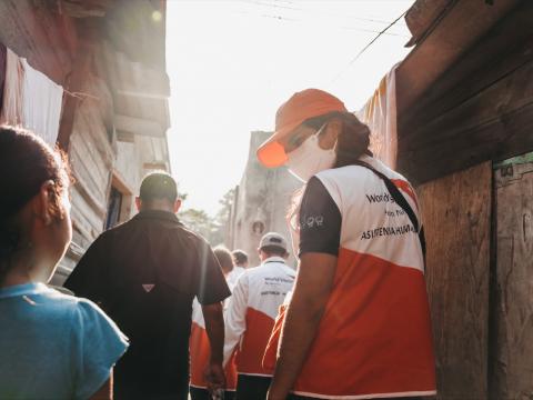 Catherine World Vision staff in Honduras walks and talks with families affected by Hurricane ETA