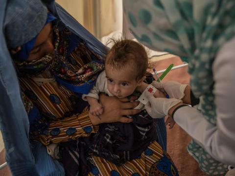 malnourished child in Afghanistan receiving therapeutic food