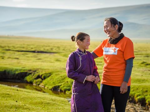 World Vision staff with child in Mongolia