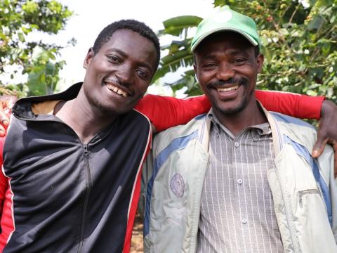 Mesfin and Birhanu hugging and smiling