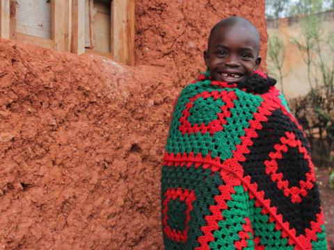 Sponsored child in Burundi that is thankful for a new blanket