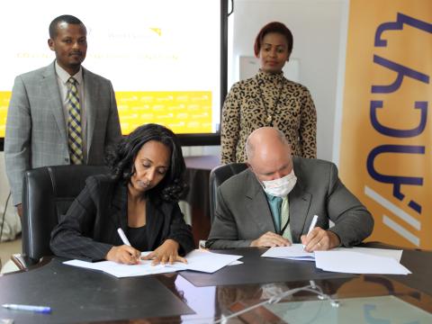 Mr. Edward and Bethelhem signing the MoU