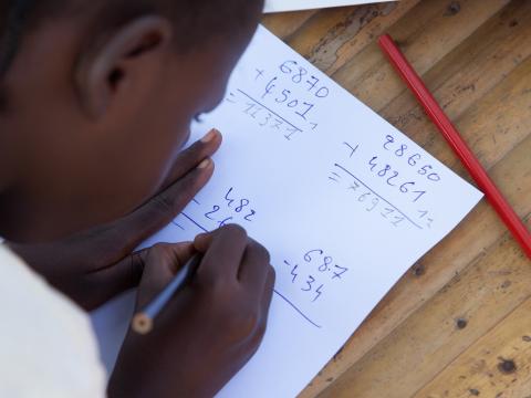 A child works on his maths work