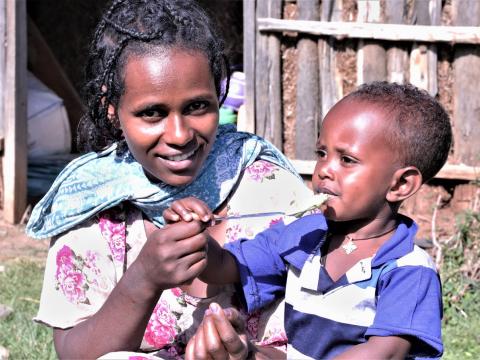 Emebet Feeds her son nutritious food