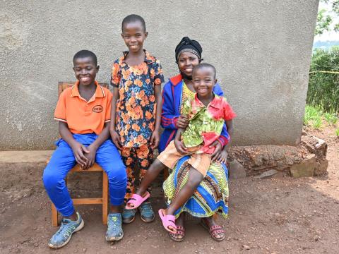 Afisa with her children at home