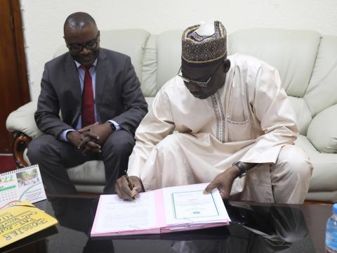 the minister of territorial signing the protocol