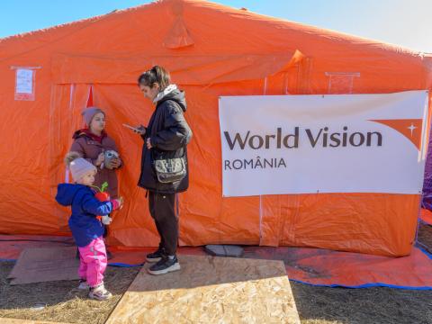 Anna, refugee from Ukraine stands outside a Child Play Space set up by World Vision in Romania