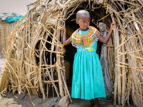 Girls stands outside her home in Marsabit in Kenya