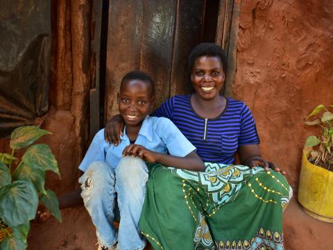 Mother and son sit on porch