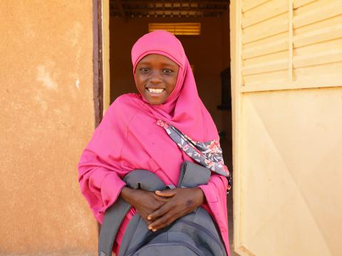 Sakina with the bag she received from World Vision