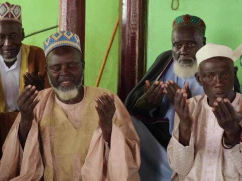 Faith leaders praying