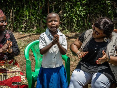 DRC Child whose mum benefited from savings group singing 