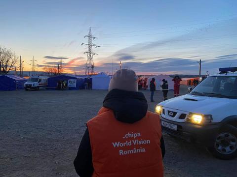 Andreea looks over refugee camp