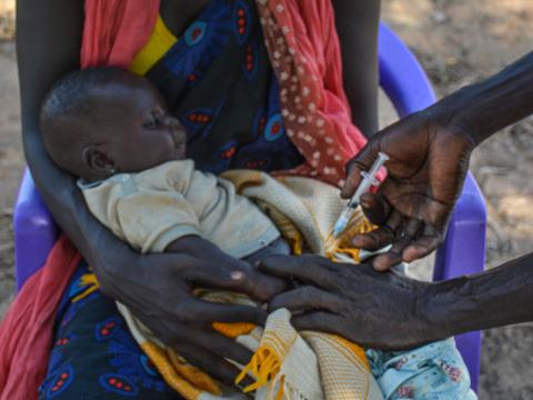Child getting an injection against polio in South Sudan