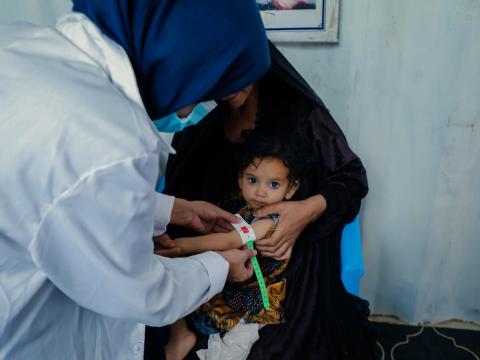 Child in Afghanistan is being checked for malnutrition