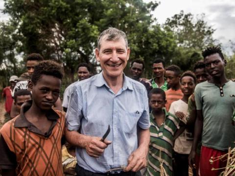 Tony Rinaudo, WV staff, surrounded by local villagers