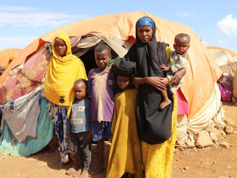 Family in Africa, mother holds child