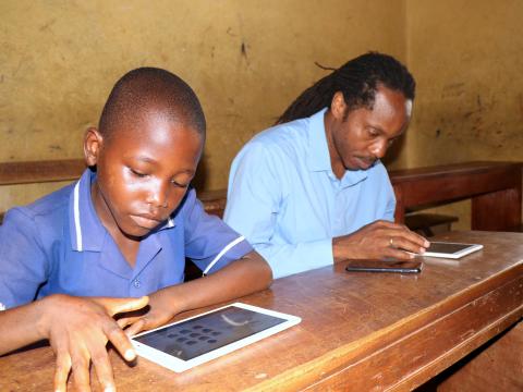 Minister and a pupil taking test