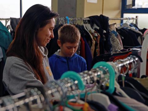 Ukrainian refugee and mother, Victoria picks up supplies for her family at RomExpo