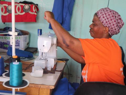 EMATHEKU SEWING MACHINE MAKING SURE THAT NO CHILD FROM MGAMUDZE COMMUNITY WEARS TORN UNIFORM