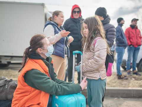 World Vision staff with a child in Ukraine.