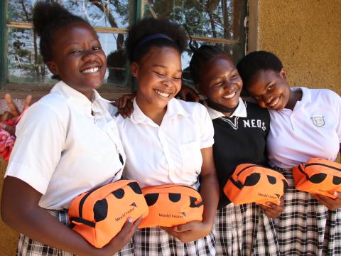 Girls hoding their menstrual hygiene kits after a menstrual hygiene training in Nyimba District